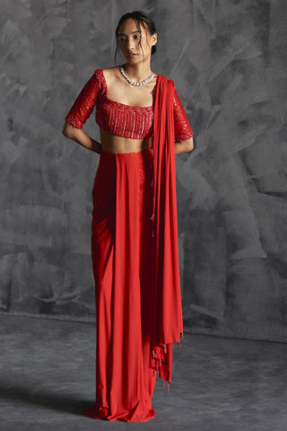 Orange pleated draped reim skirt with embellished elbow sleeve blouse