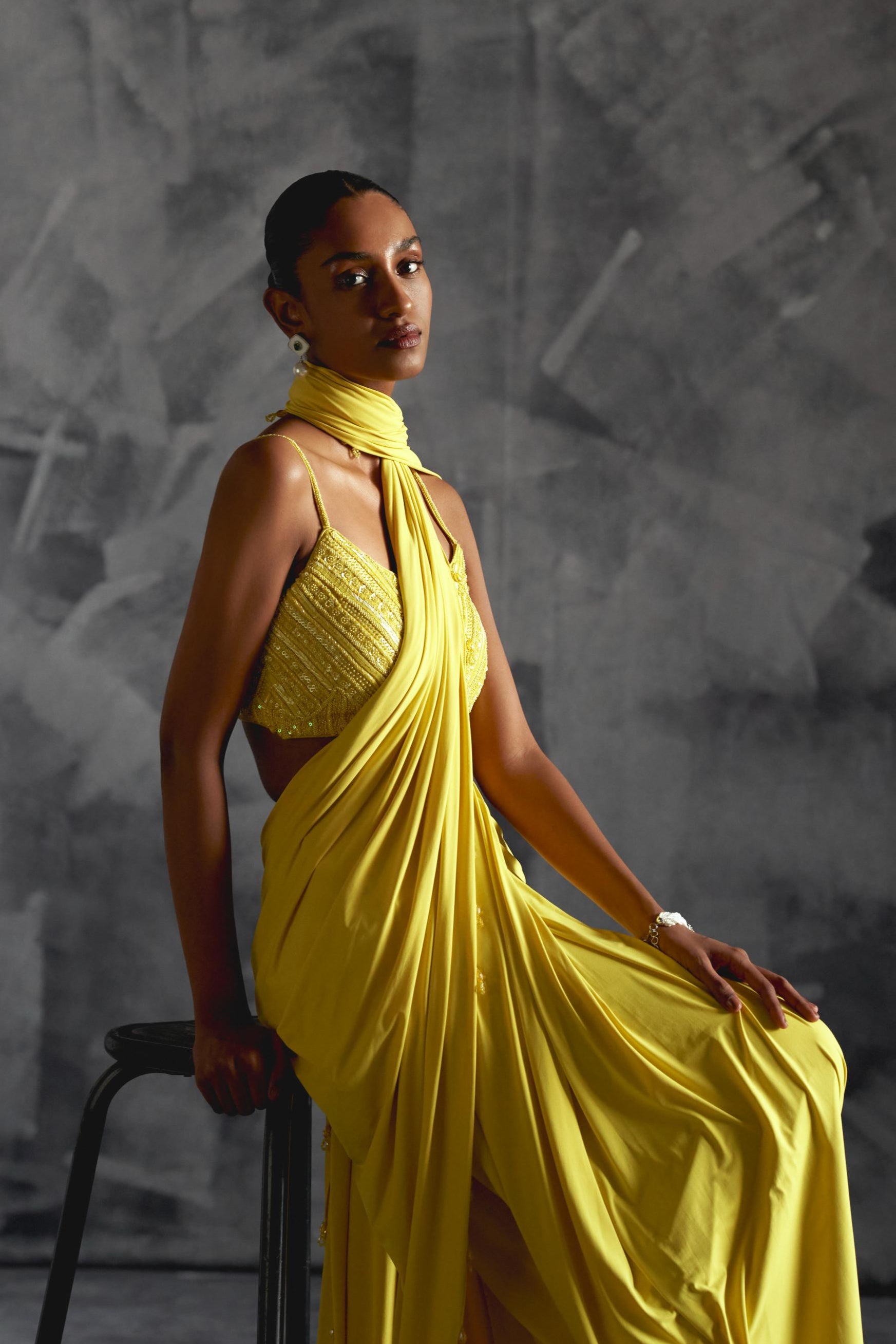 Yellow fitted draped reim saree with strappy embellished blouse