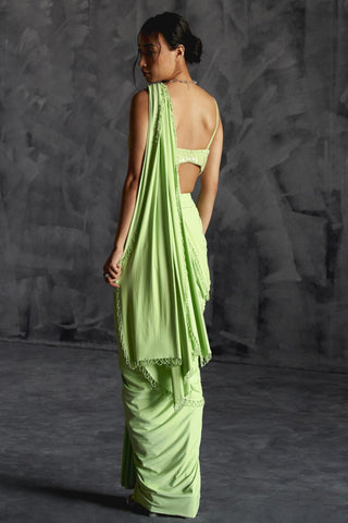 Green high slit reim saree with strappy blouse