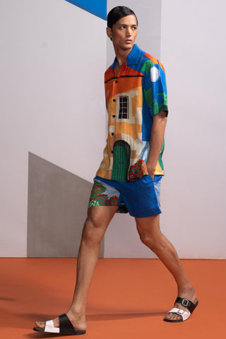 Blue house on the shore postcard polo shirt