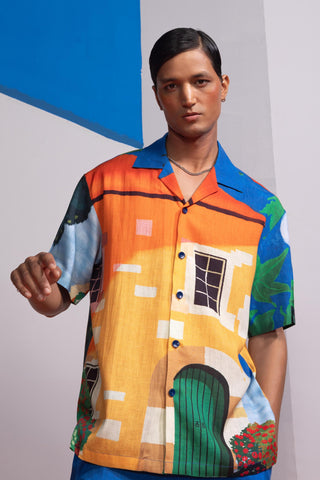 Blue house on the shore postcard polo shirt