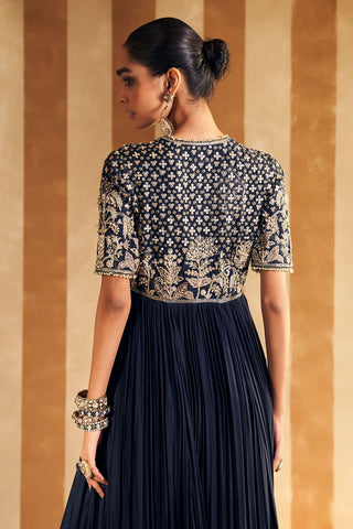 Back view of the navy zarqaa anarkali showing the embroidered back yoke, elbow sleeves and pleated skirt at Mrs. G
