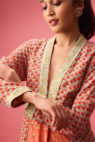 Orange kalidar kurta with print and embroidery paired with churidar