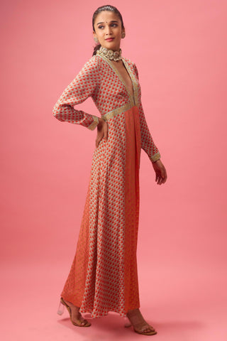 Orange kalidar kurta with print and embroidery paired with churidar