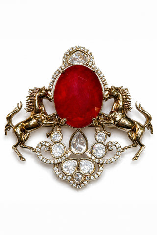 Flat product view of the gold and ruby red horse brooch with red stone showing bold oval red stone at Mrs. G
