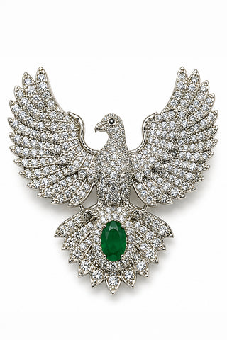 Flat product view of the silver zircon bird brooch with green stone showing oval green center stone at Mrs. G
