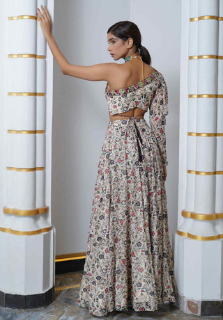 Cream floral one shoulder blouse and lehenga