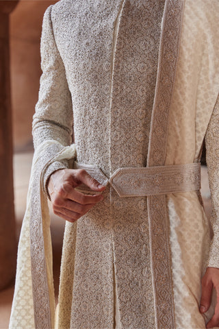 Ivory tarana arabesque resham sherwani set by Nitika Gujral at Mrs. G