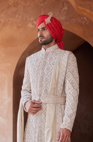 Ivory tarana gold dori embroidered sherwani set by Nitika Gujral at Mrs. G