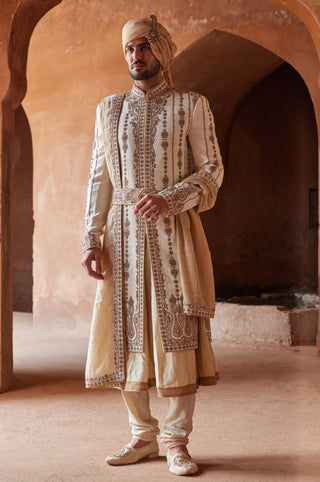 Ivory tarana antique zardozi sherwani set by Nitika Gujral at Mrs. G