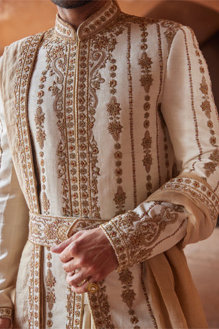 Ivory tarana antique zardozi sherwani set by Nitika Gujral at Mrs. G