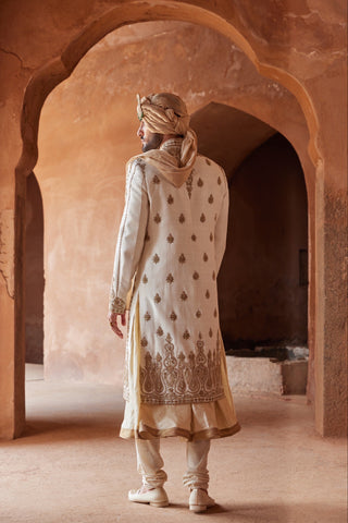Ivory tarana antique zardozi sherwani set by Nitika Gujral at Mrs. G