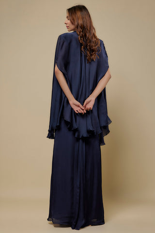 Back view of the navy organza cape with slit sleeves over the satin skirt by Asaga at Mrs. G
