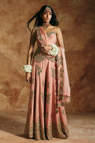 Front view of the onion pink set with the dupatta's tasseled end falling at the side by Aman Takyar at Mrs. G