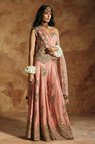 Three-quarter side view of the onion pink set showing the embroidered sharara hem by Aman Takyar at Mrs. G