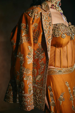 Close-up of the jacket's gold zardozi floral work beside the corset's sweetheart embroidery by Aman Takyar at Mrs. G