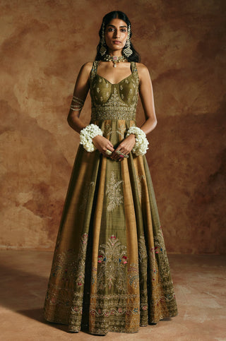 Front view of the green rust anarkali set with corset-style bodice and embroidered hem by Aman Takyar at Mrs. G