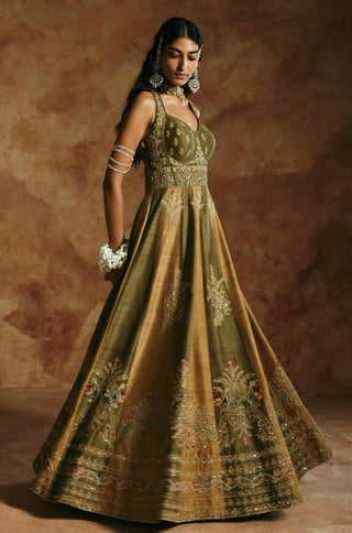 Three-quarter view of the green rust anarkali set in motion with jasmine bracelets by Aman Takyar at Mrs. G