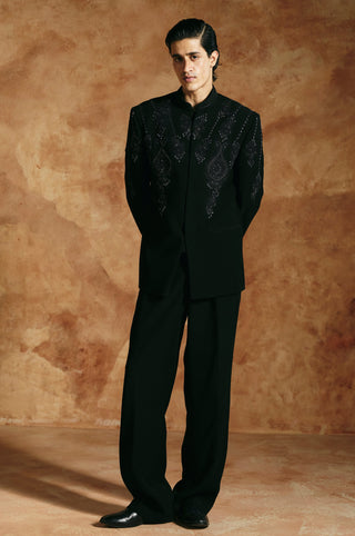 Straight-on full-length view of the black bandhgala set with teardrop beadwork on the chest by Aman Takyar at Mrs. G