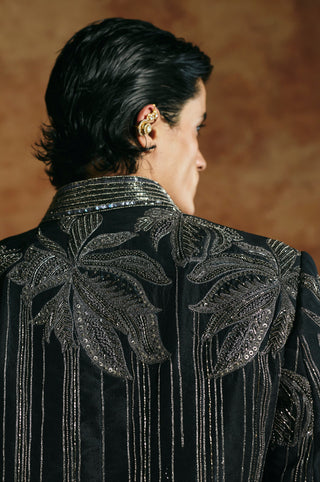 Close-up of the black jacket back with silver palm leaf embroidery and a beaded collar by Aman Takyar at Mrs. G