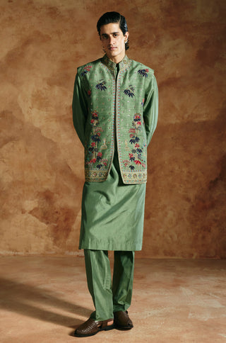 Full-length view of the green nehru jacket set with a matching kurta and pants by Aman Takyar at Mrs. G