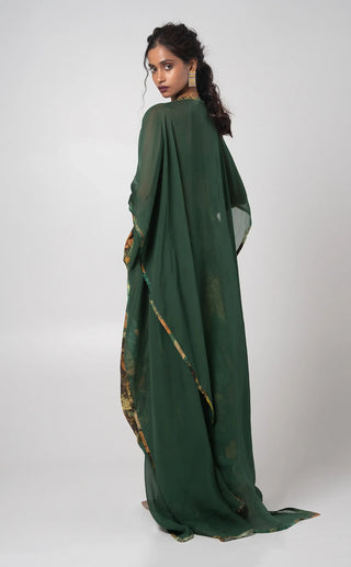 Green embroidered bustier with dhoti pants and a cape