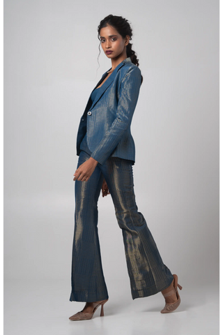 Blue organza blazer paired with a bustier and flared trouser