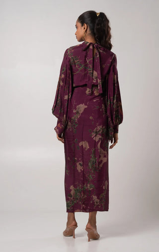 Purple high neck top paired with a skirt