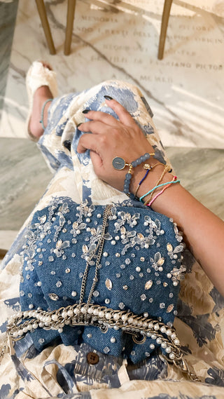 Blue pearl-embellished bag with crossbody chain