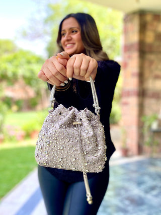 Gray dazzling bucket bag with shimmering crystals