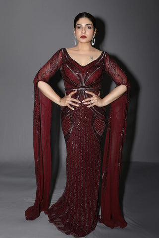 Burgundy embroidered gown with floor-length sleeves