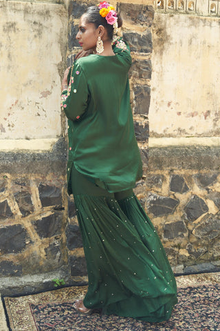 Emerald green silk features hand embroidered sharara set