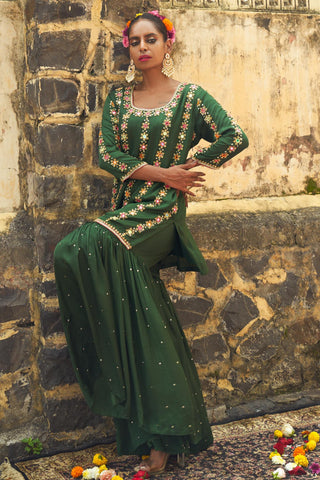 Emerald green silk features hand embroidered sharara set