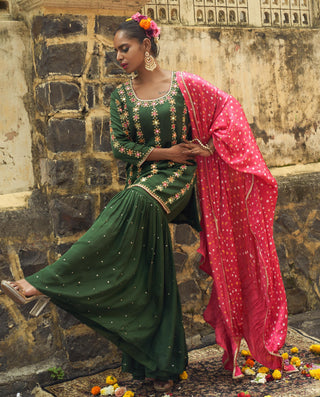 Emerald green silk features hand embroidered sharara set