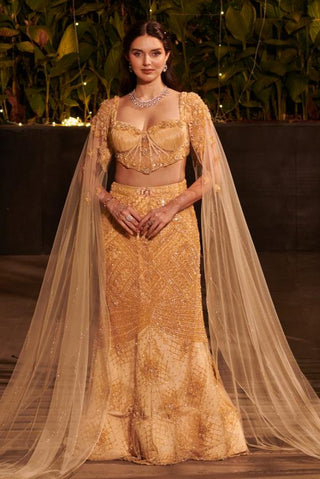Champagne gold mermaid lehenga set hitch with detachable cape