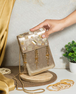 Gold nagma clutch