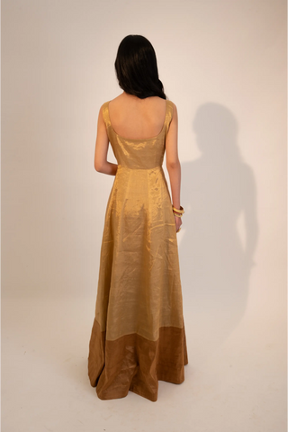 Beige zari tissue gold dual tone anarkali paired with rust dupatta