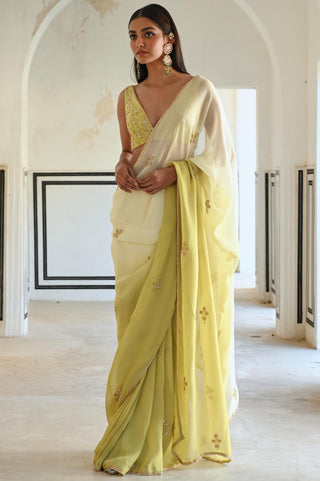 Olive-green rahi saree with deep blouse