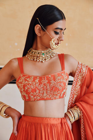 Orange rahi blouse with lehenga and dupatta