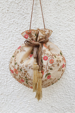 Beige floral creeper cream potli bag