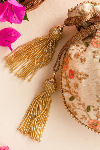 Beige floral creeper cream potli bag