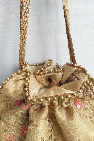 Gold floral creeper potli bag