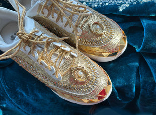 Egyptian-Inspired gold mirror sneakers