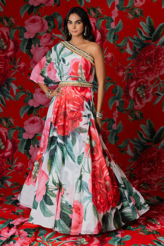 White floral one shoulder kaftan top paired with a flared skirt