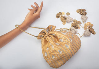 Banarasi gold potli with pearls