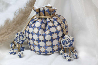 White classic jaali work cream potli