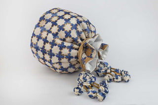 White classic jaali work cream potli