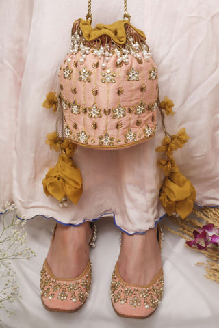 Pink maharani haar-inspired kundan potli