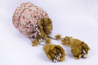 Pink maharani haar-inspired kundan potli