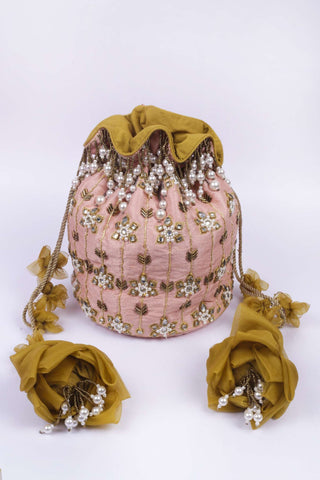Pink maharani haar-inspired kundan potli
